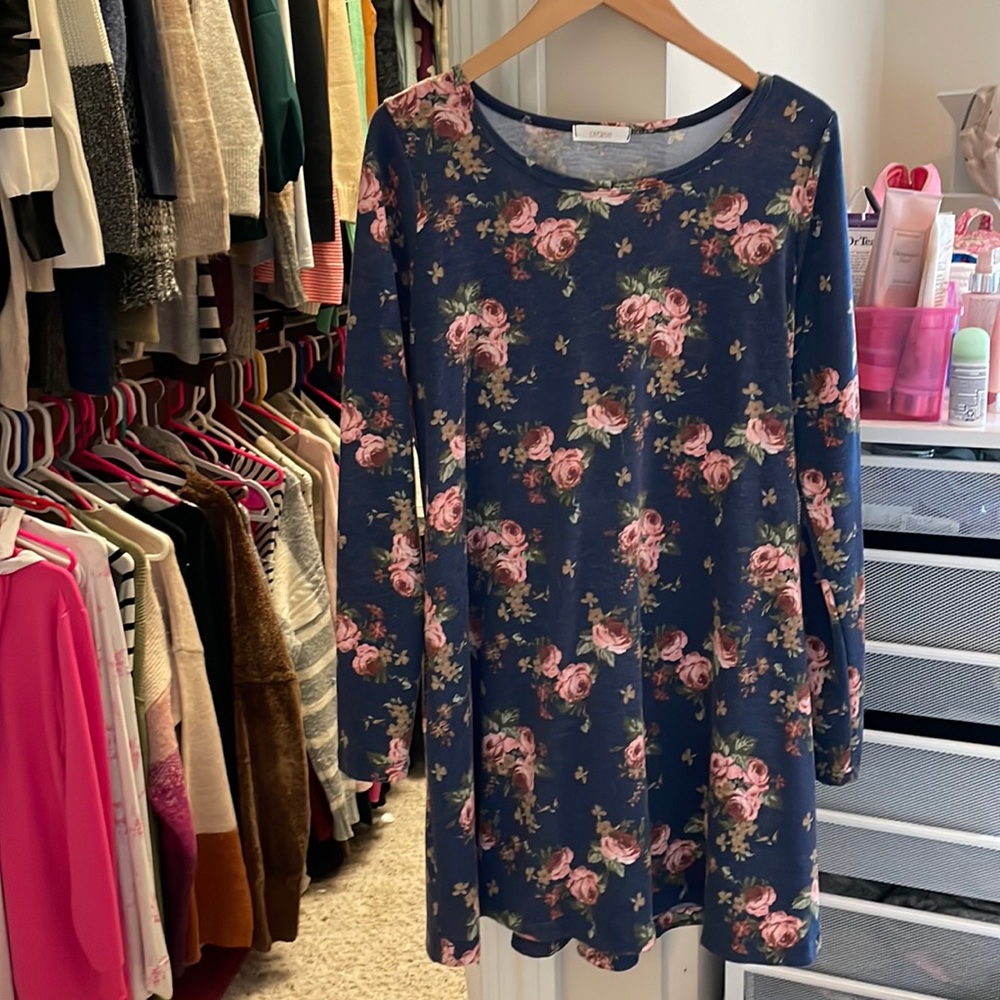 Lightly worn navy blue swing dress with pink flowers. Not lined.
